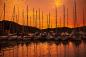 Preview: Fototapete MS-5-2776 „Boote & Schiffe“ als flache Draufsicht; maritimes Motiv mit Masten und Sonnenuntergang in warmen Farben
