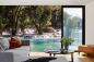 Preview: Fototapete MS-5-3160 mit Wasserfall-Motiv in einem modern eingerichteten Wohnraum